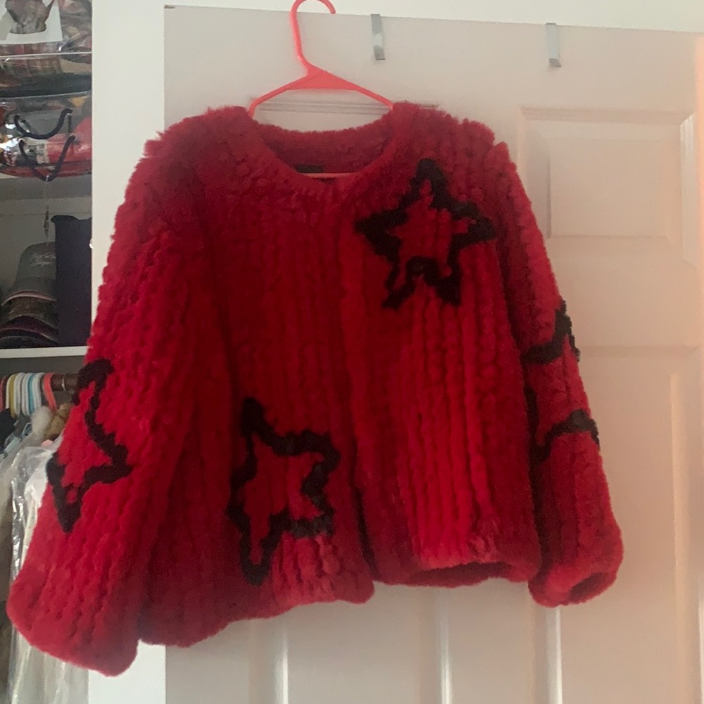 Faux fur coat, polyester. Incredibly soft. Red with black stars